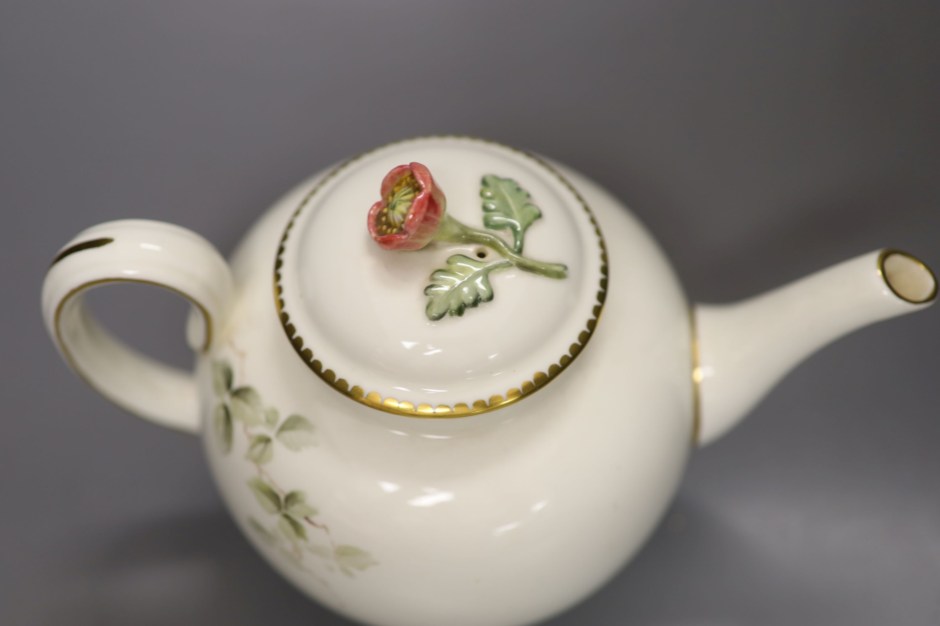 A Royal Worcester teapot and cover, painted with a Robin on a branch by E. Townsend, signed, black mark, height 15cm